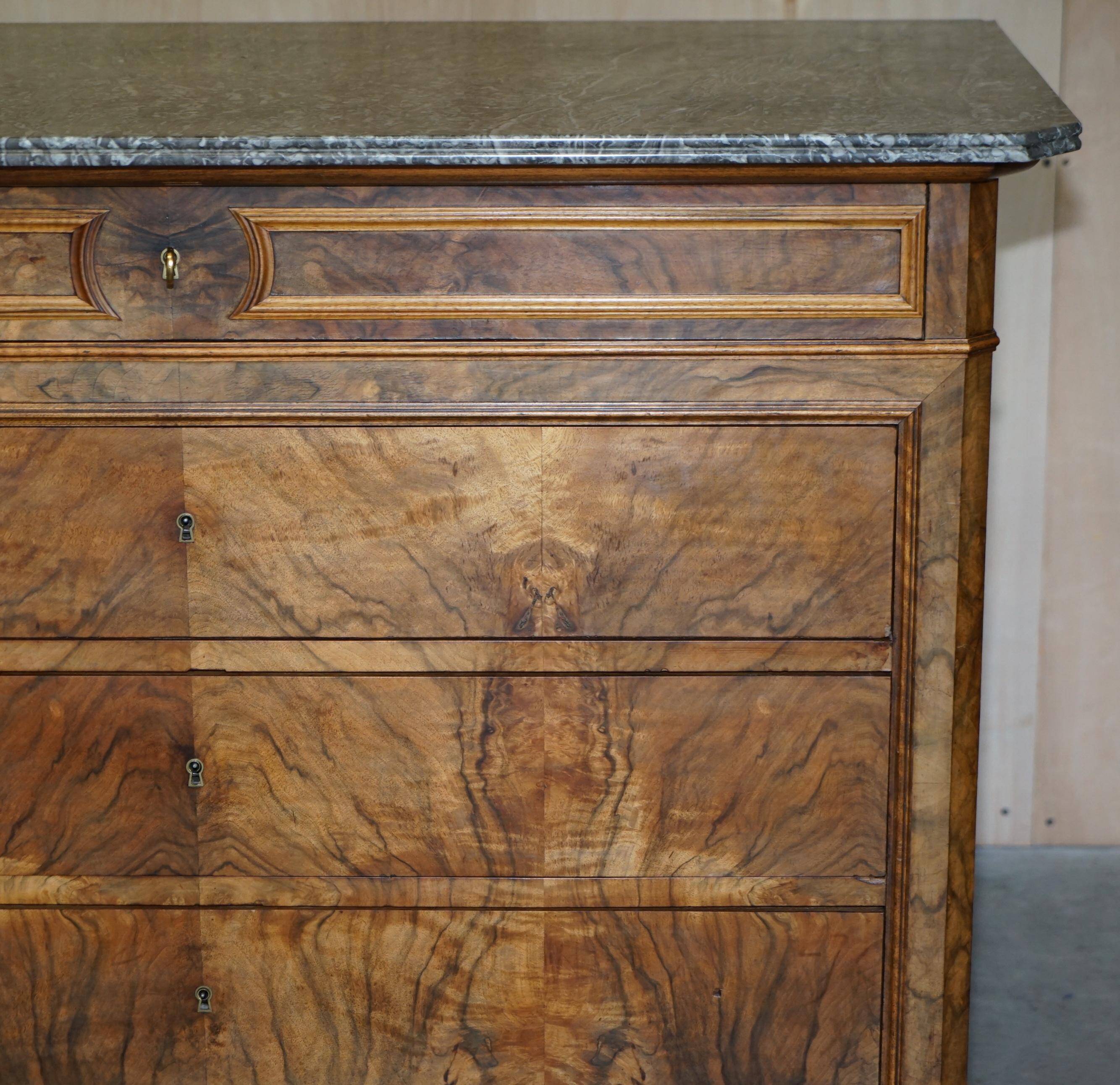 Antique walnut commode from 1860 with a marble top and original key.