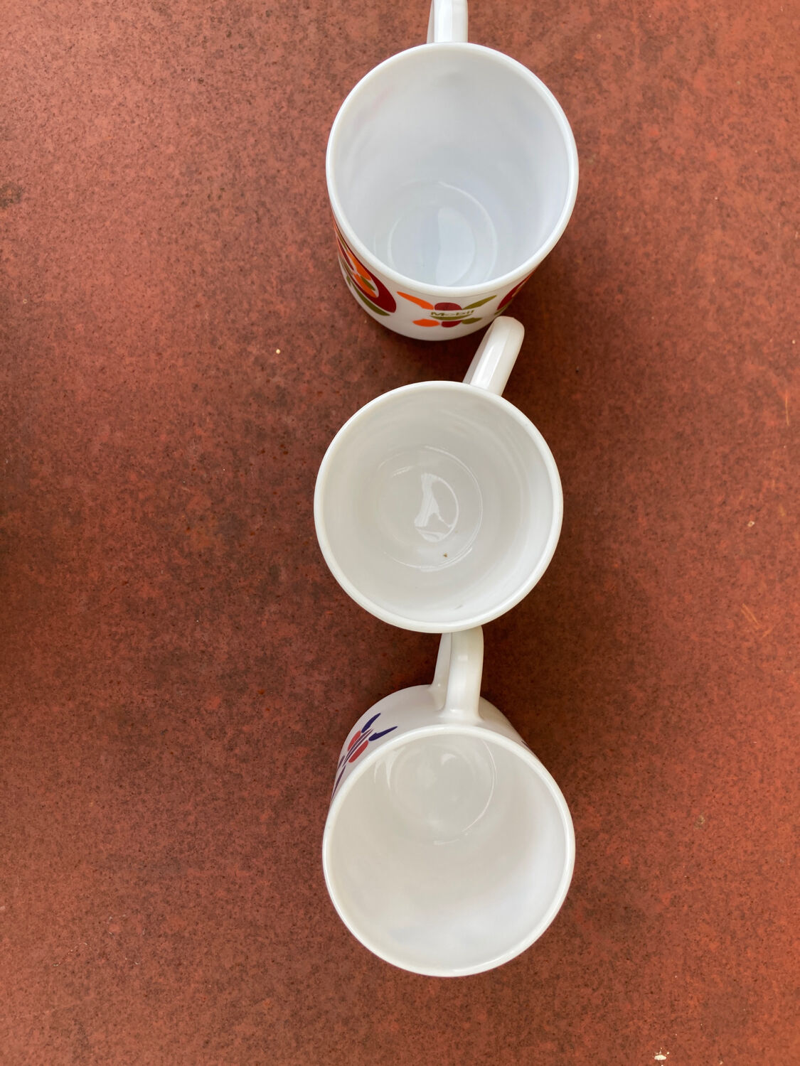 Three Mobil cups
