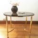 Brass round coffee table and smoked glass