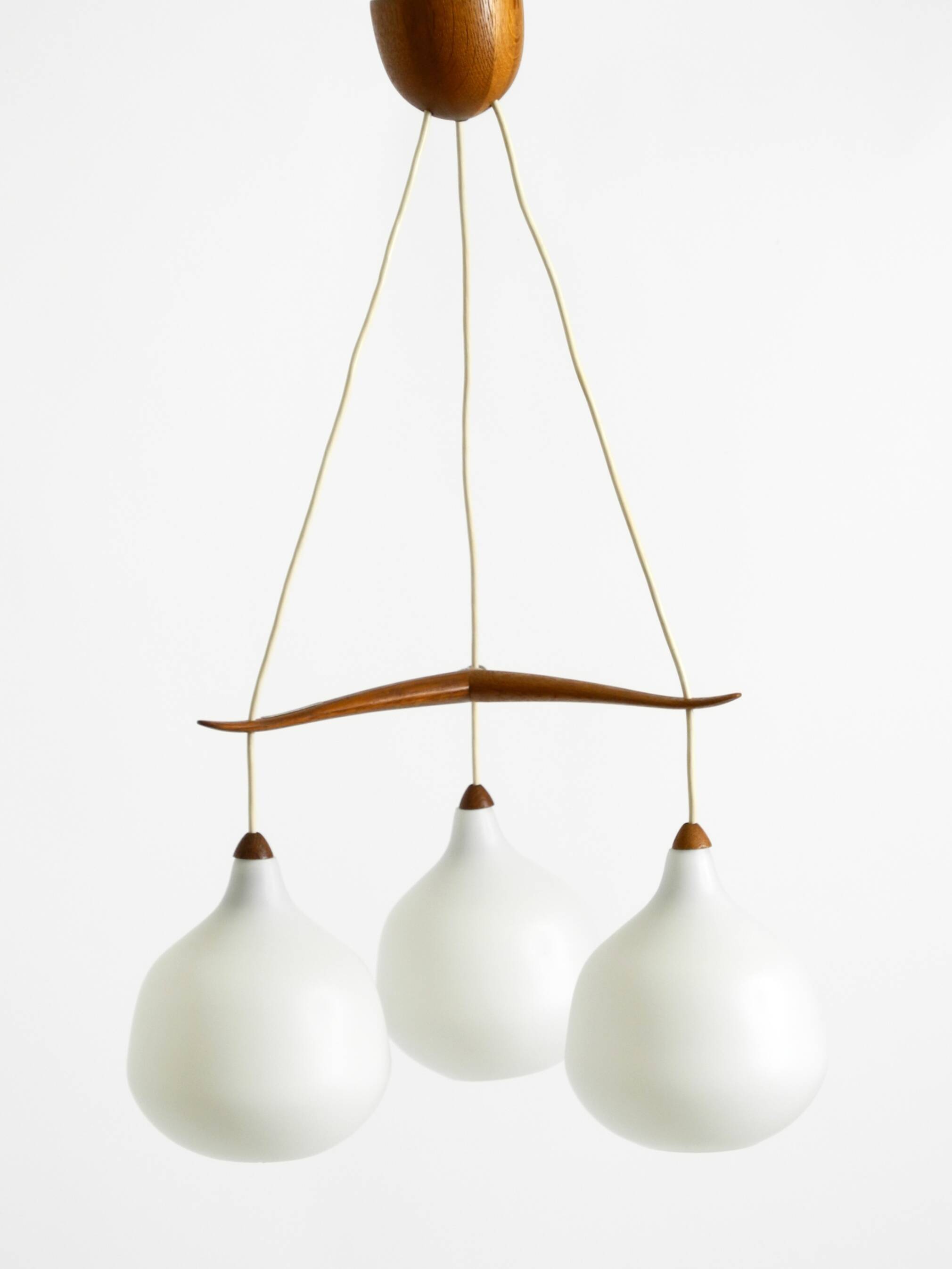 Pendant lamp with opal glass shades teak frame by Uno & Östen Kristiansson