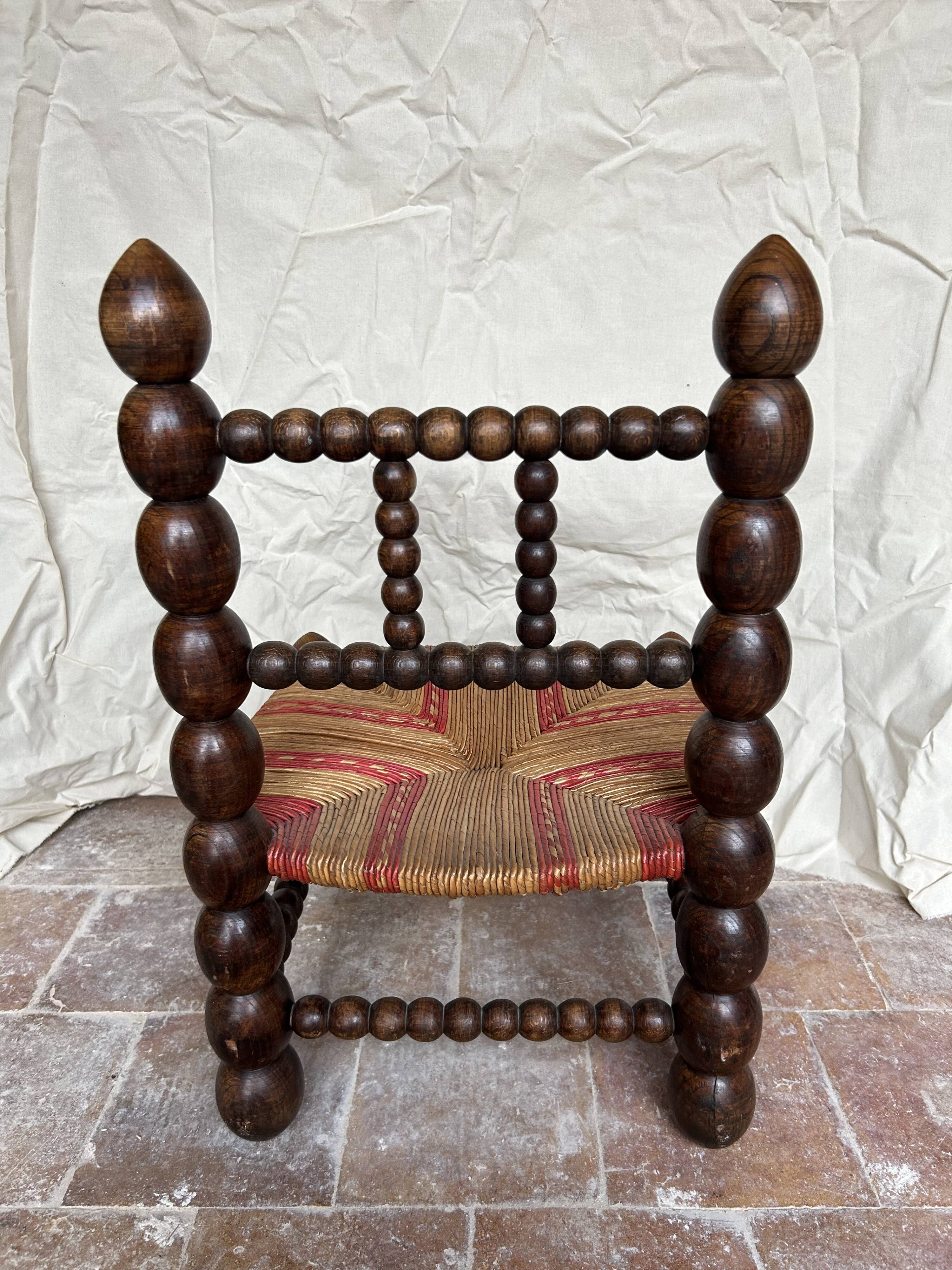 Turned wooden chair by Charles Dudouyt