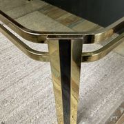 Vintage 1970s coffee table in gold metal and smoked glass.