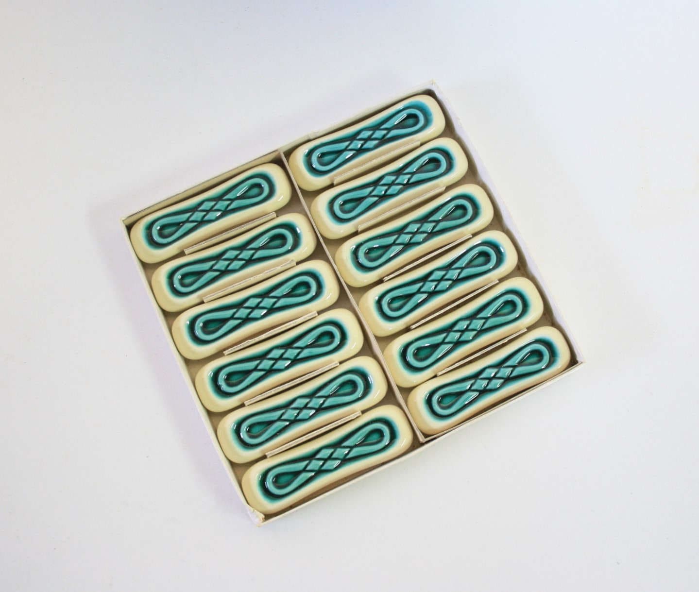 Set of twelve turquoise ceramic knife holders