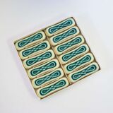 Set of twelve turquoise ceramic knife holders