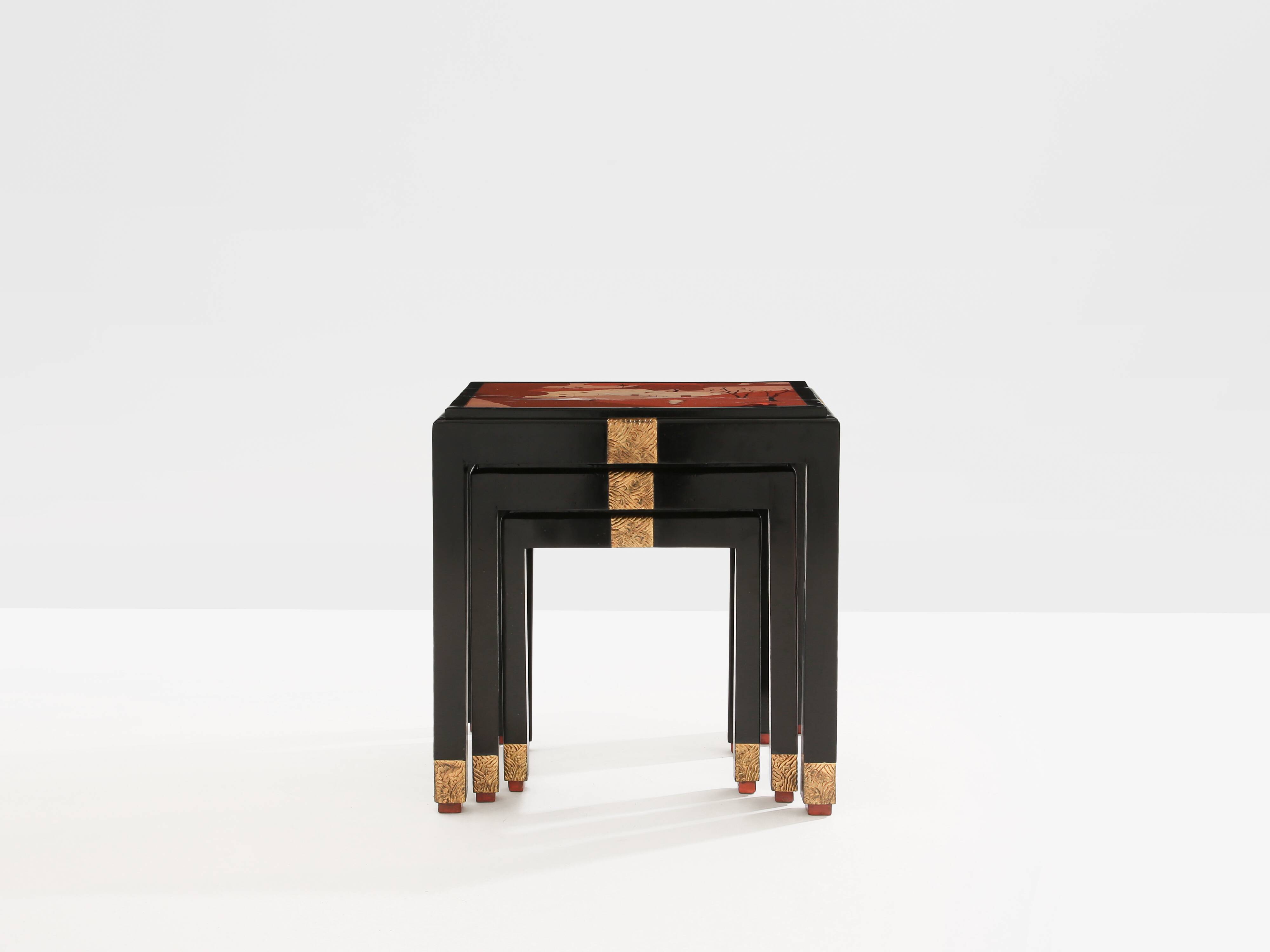 Set of three nesting tables with Asian decor, blackened wood, circa 1920.