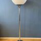 Guzzini Flash Space Age floor lamp with a chrome base and white acrylic shade.