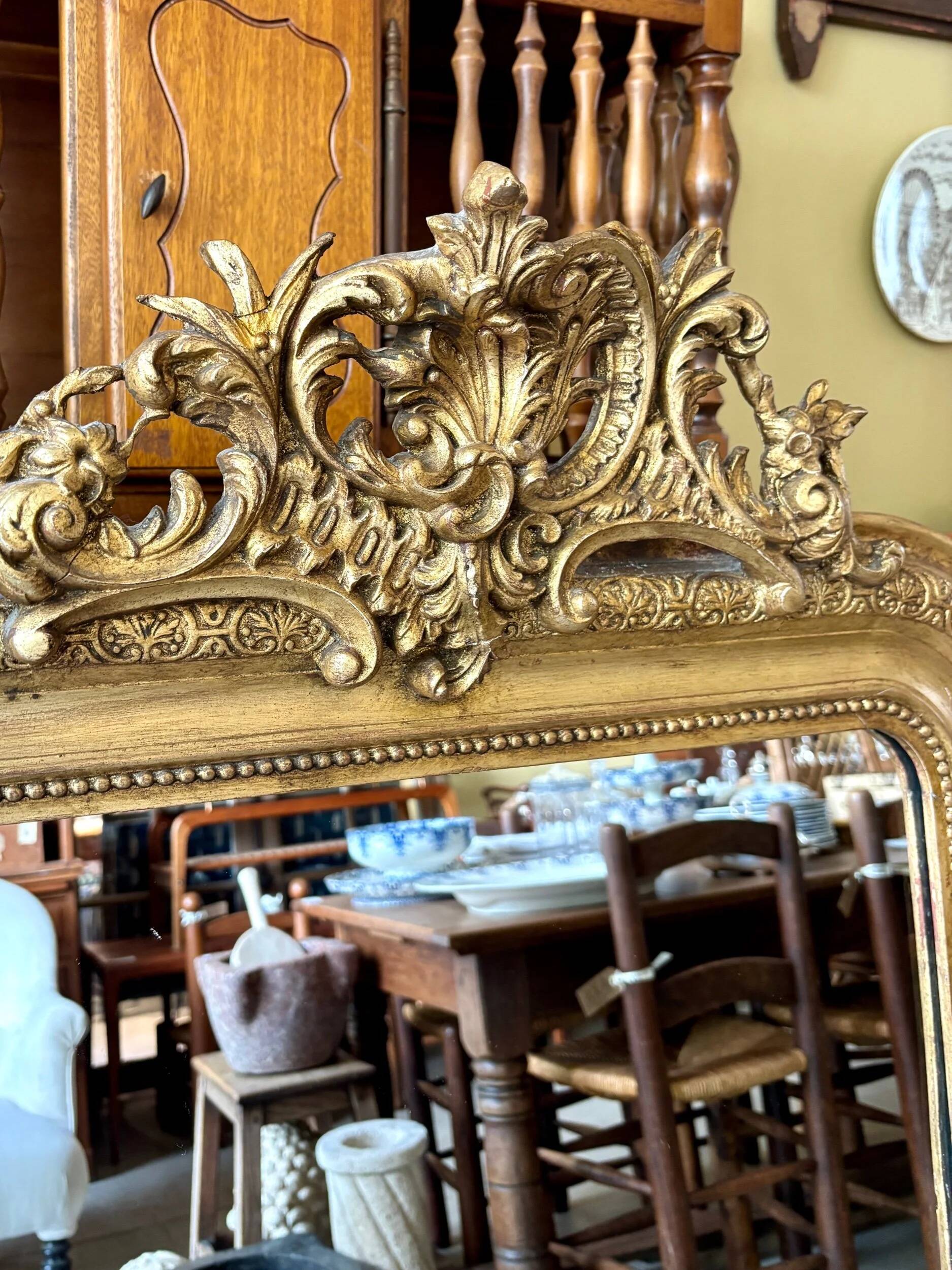 Gold sculpted and moulded stucco trumeau mirror 113 x 78 cm
