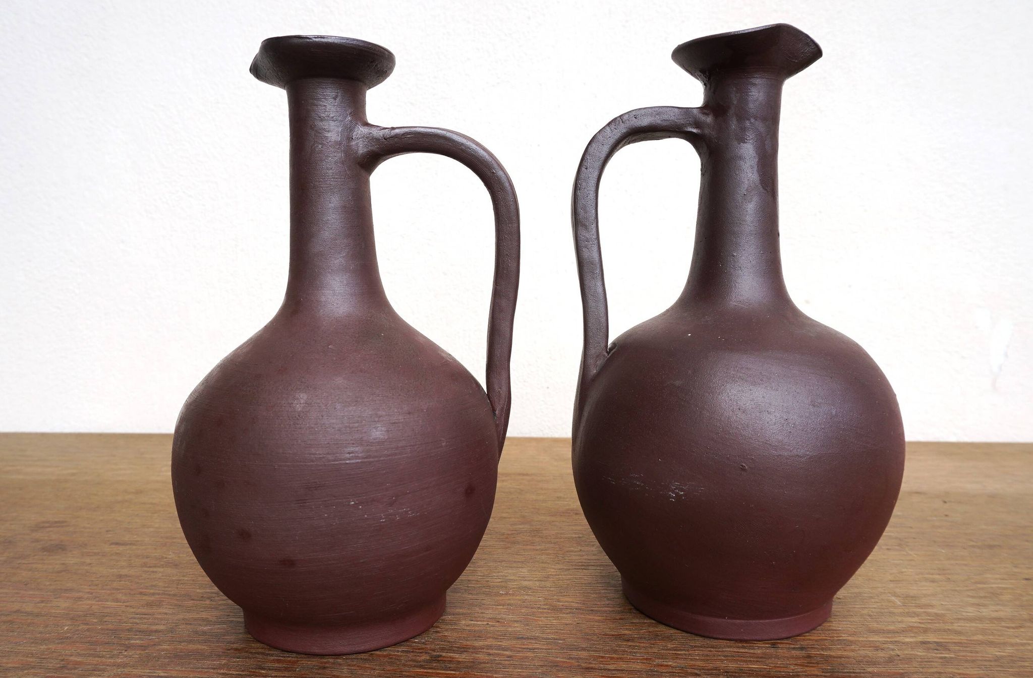 pair of terracotta bottles or carafes
