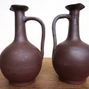 pair of terracotta bottles or carafes