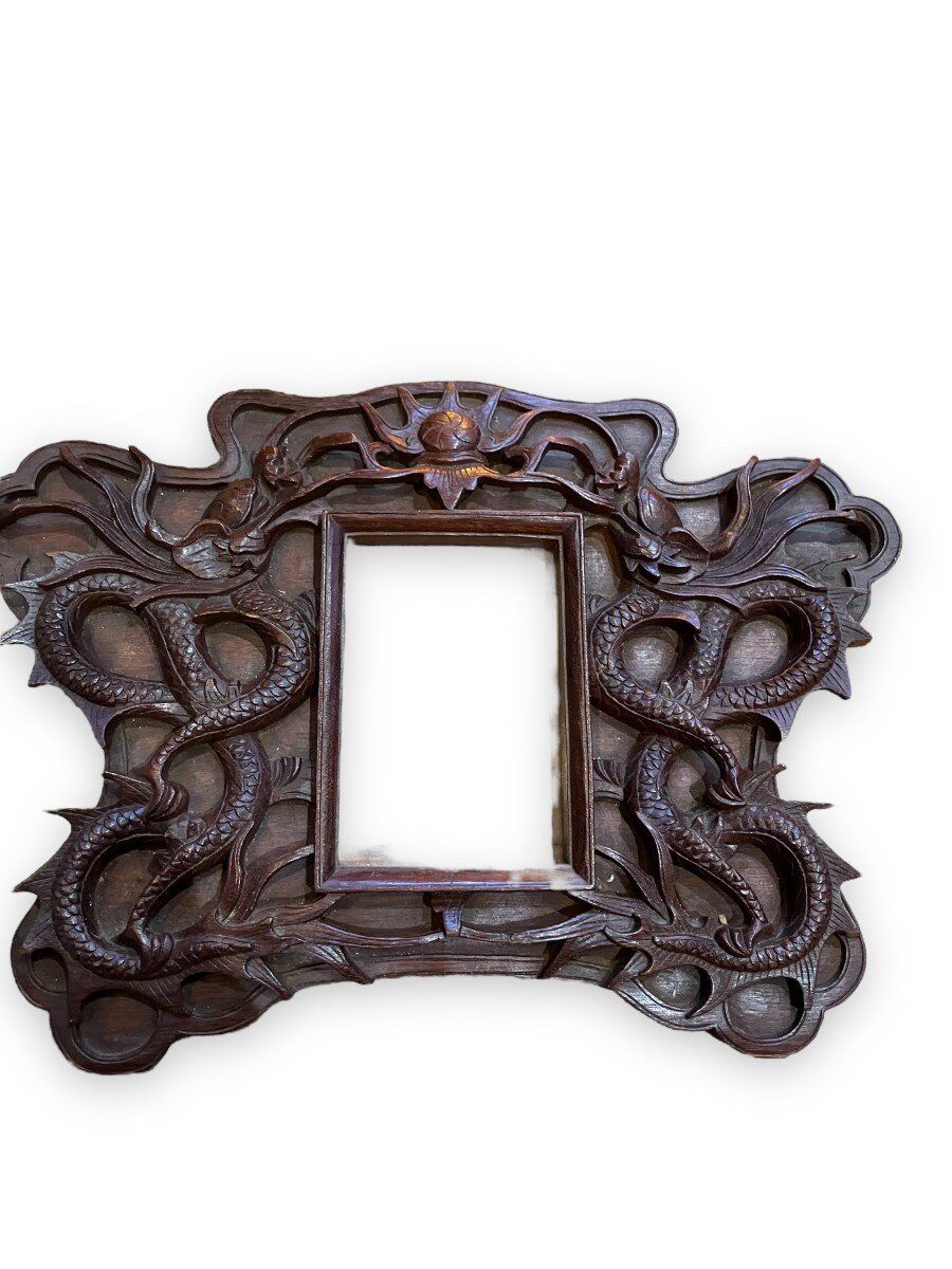 Pair of exotic wooden frames with dragons