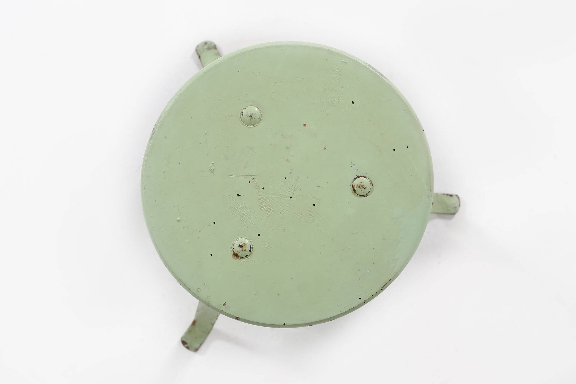 Industrial green painted stool with steel base and wooden top, France 1930s