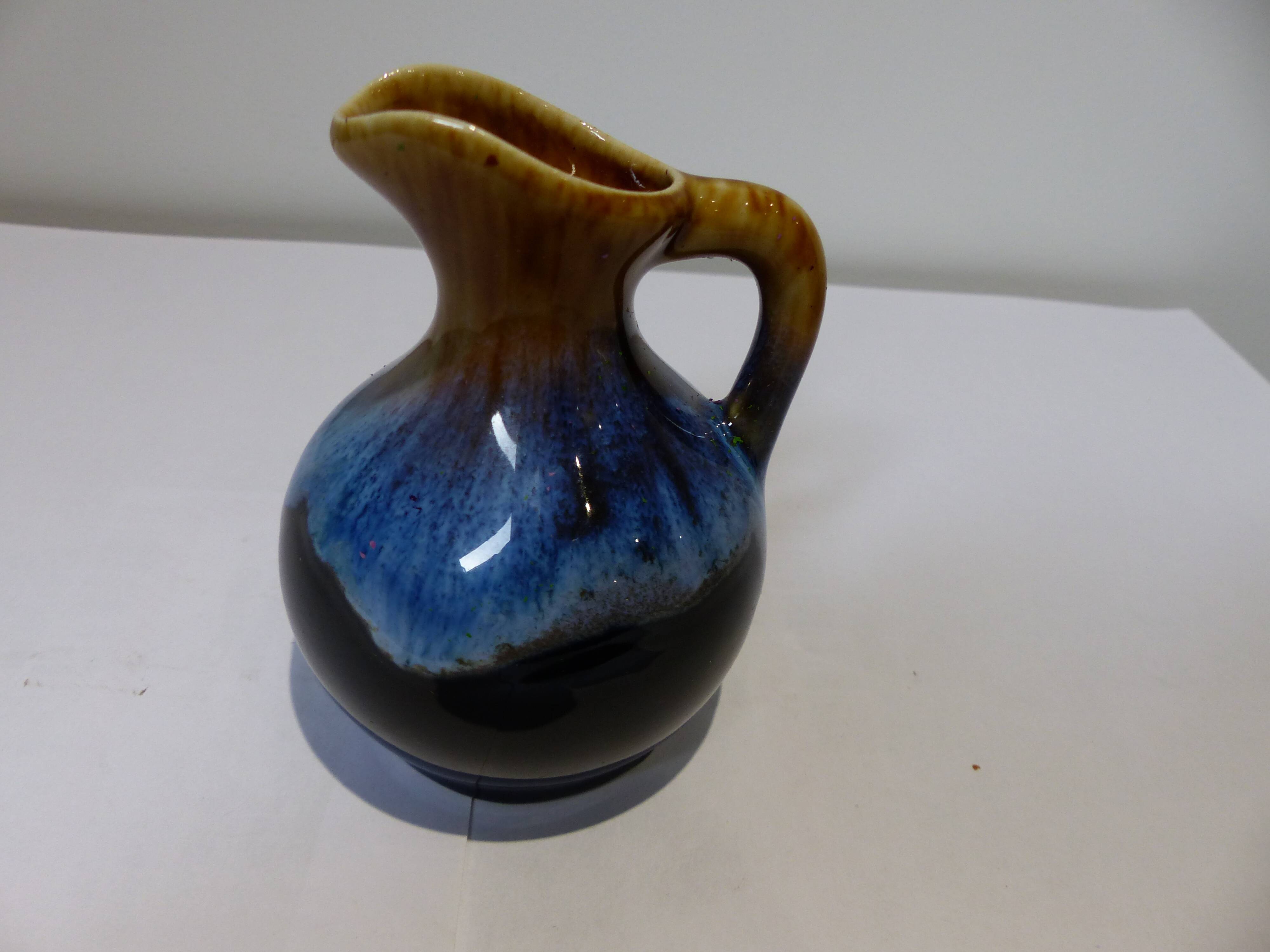 Small vintage ceramic pitcher Blue and brown black reflections