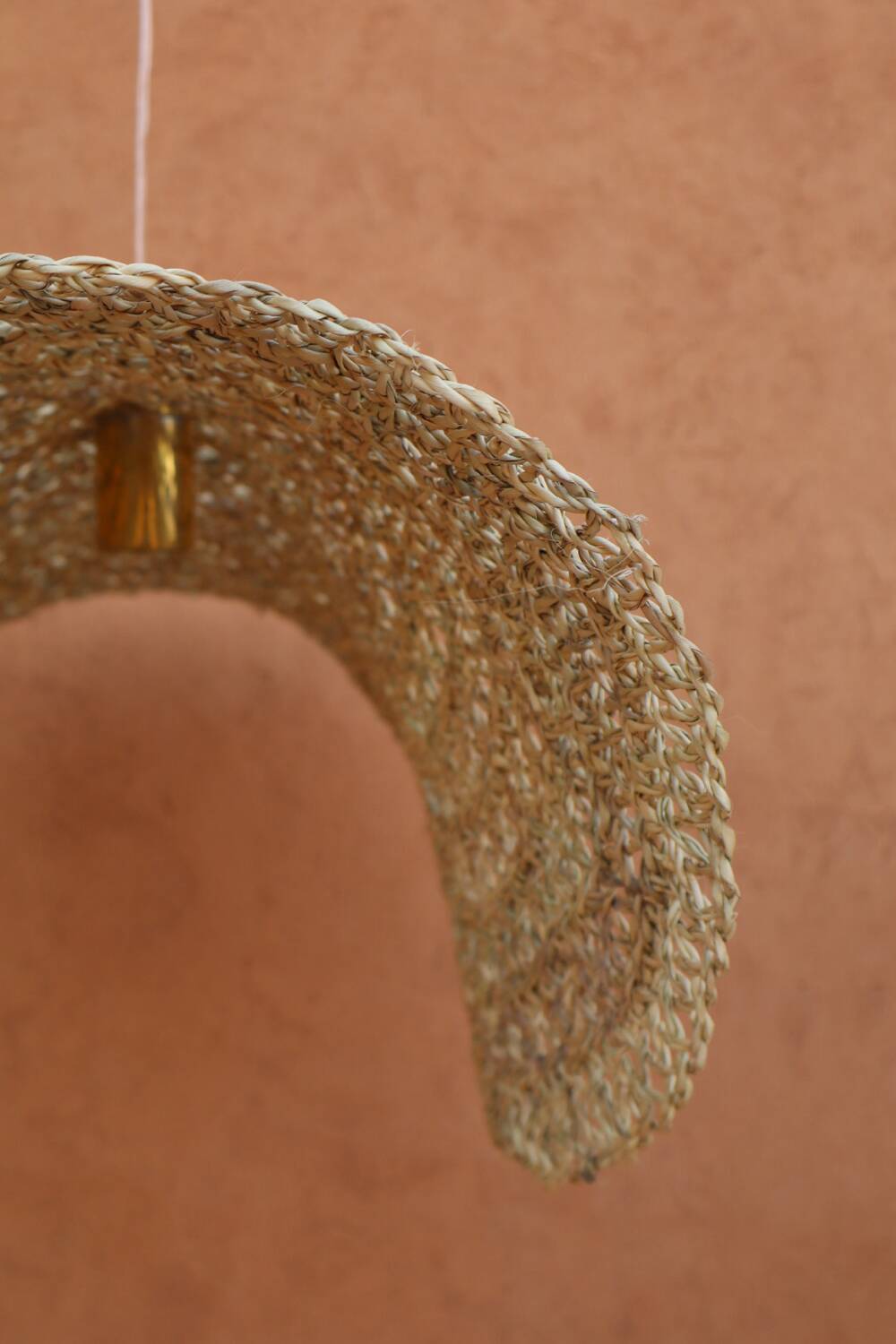 Handmade wicker hanging basket with brass finish