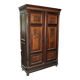 Hungarian wardrobe in carved brown wood from the late 19th century, with 2 doors and a lower drawer.