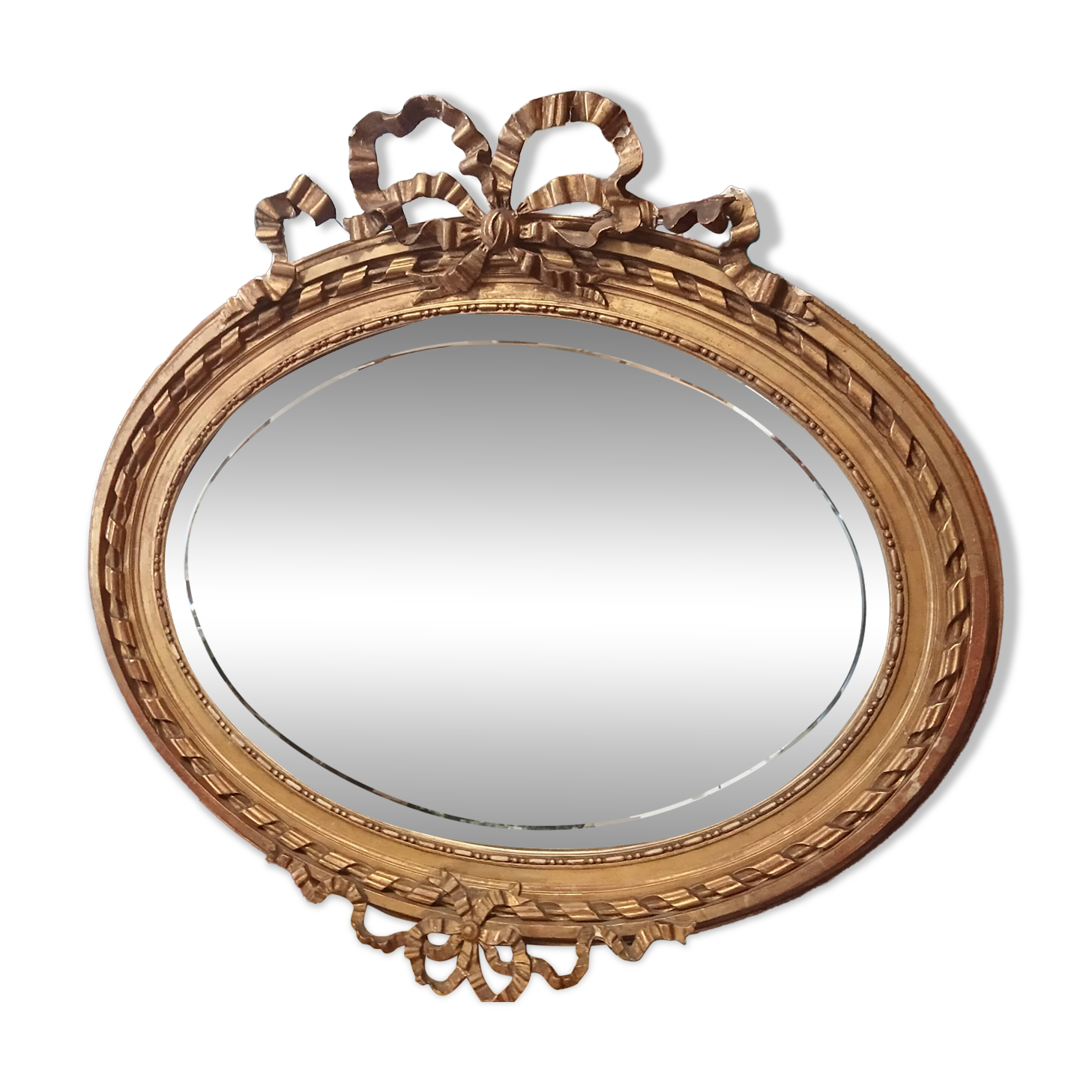 Golden leaf medallion mirror.