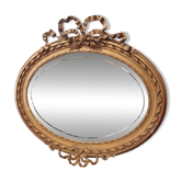 Golden leaf medallion mirror.