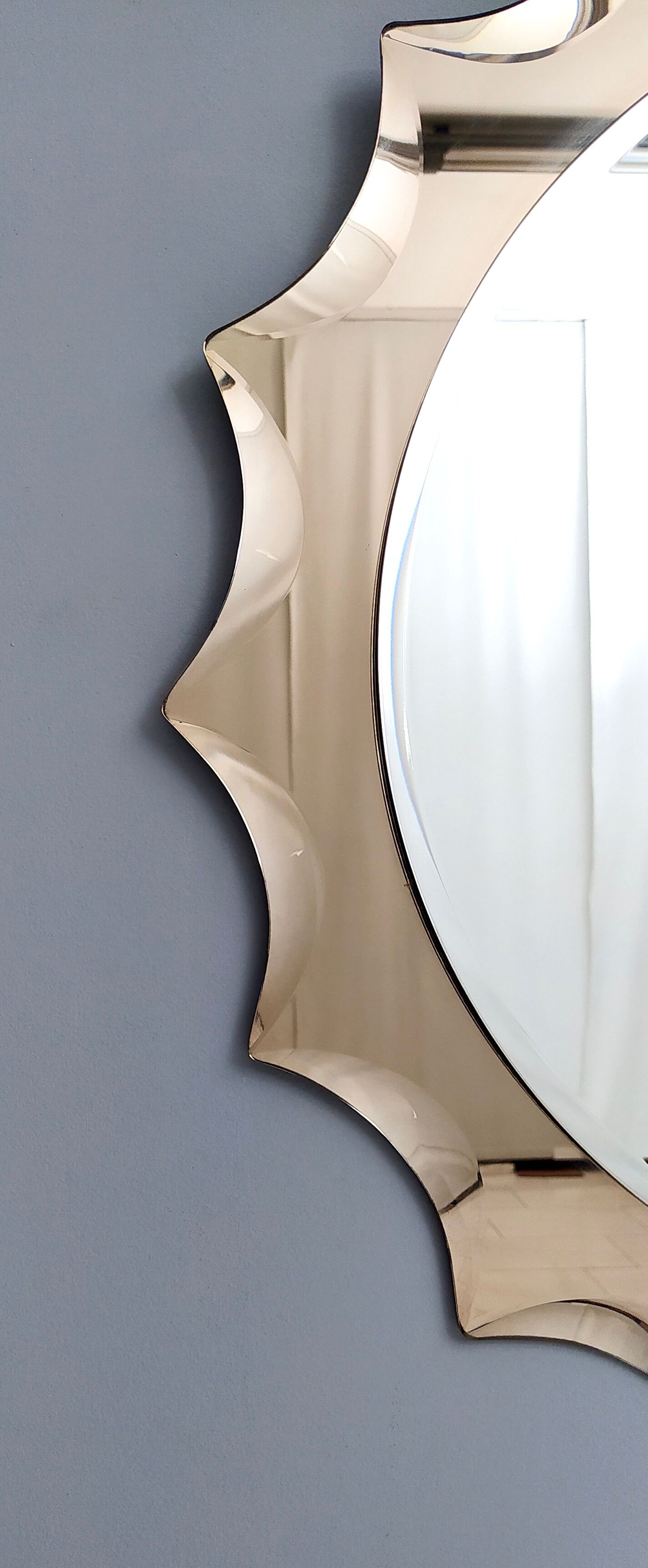 Postmodern sun shaped bronze wall mirror, italy