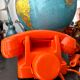 Orange vintage dial phone