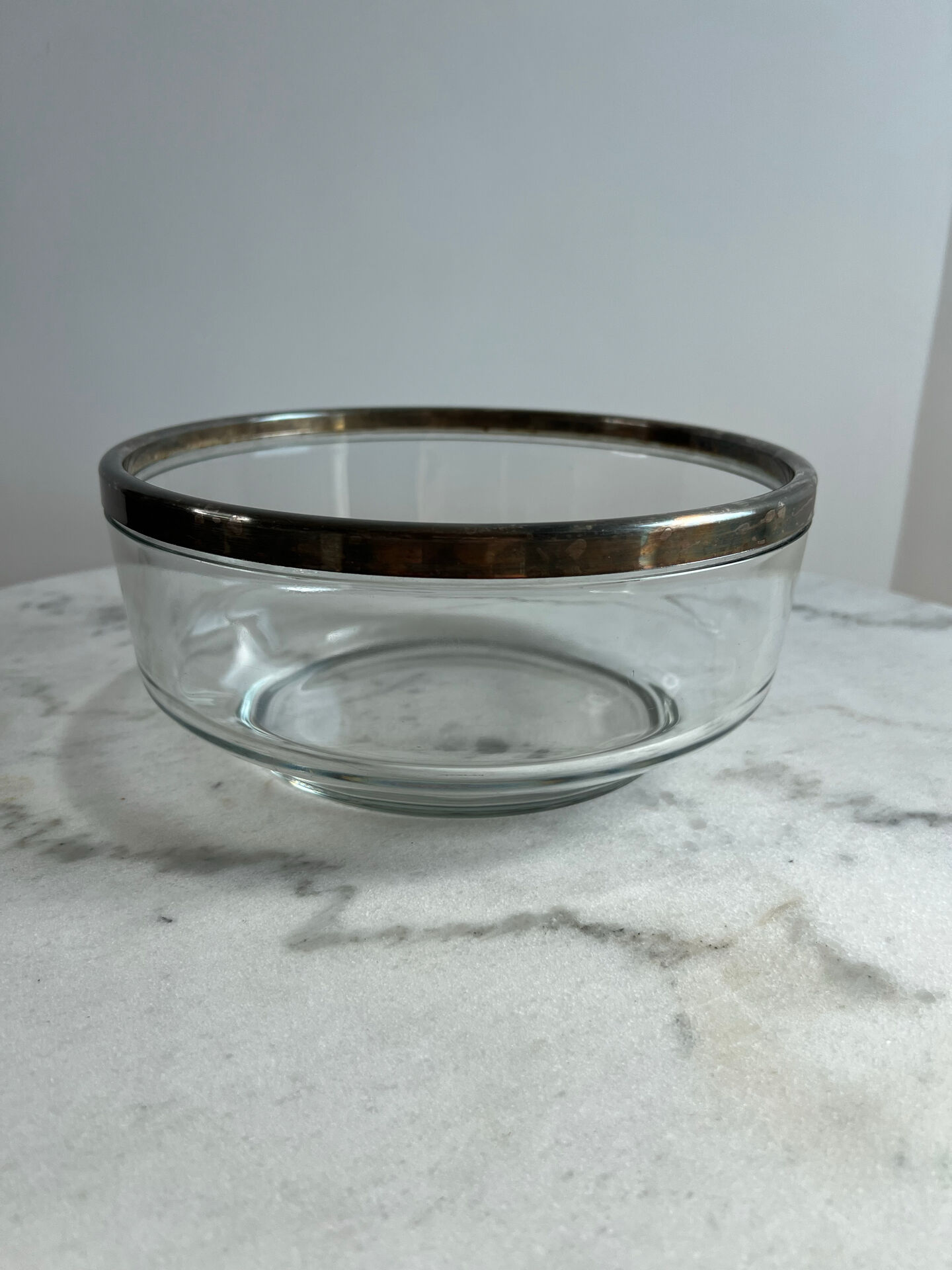 Glass and silver-plated metal salad bowl, silver rim.