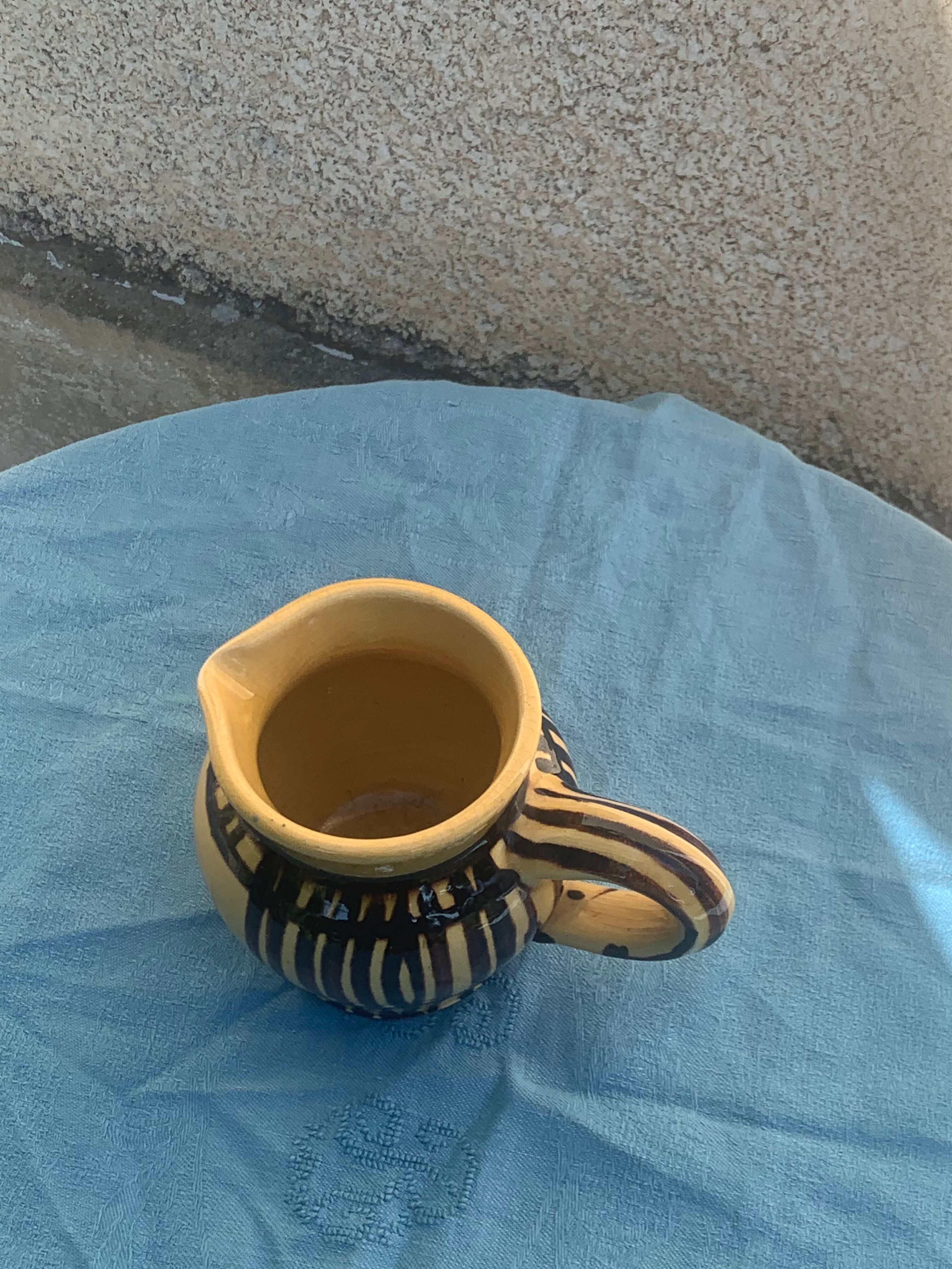 Vintage prince henry enamelled ceramic pitcher