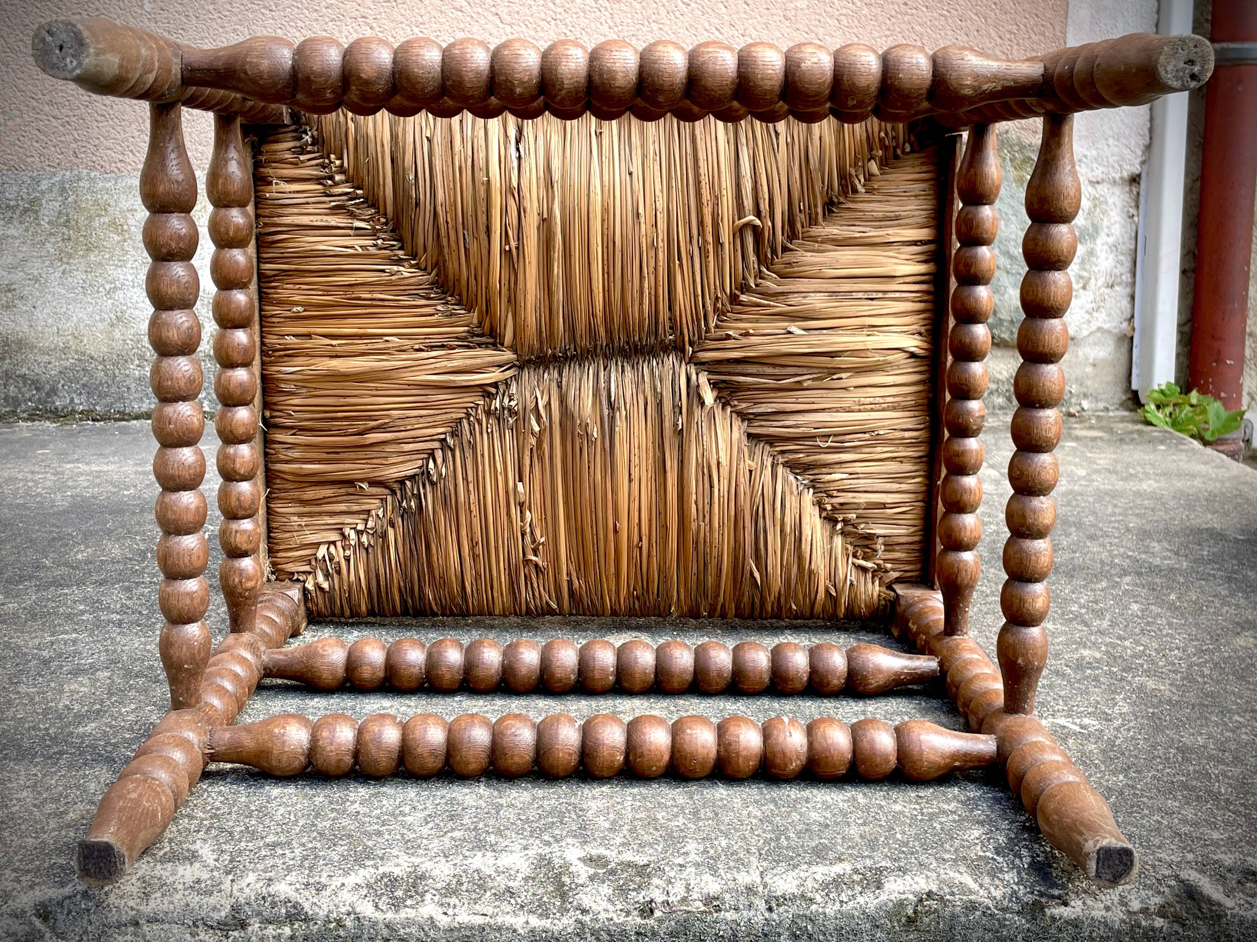Antique Bobbin armchair with straw seat