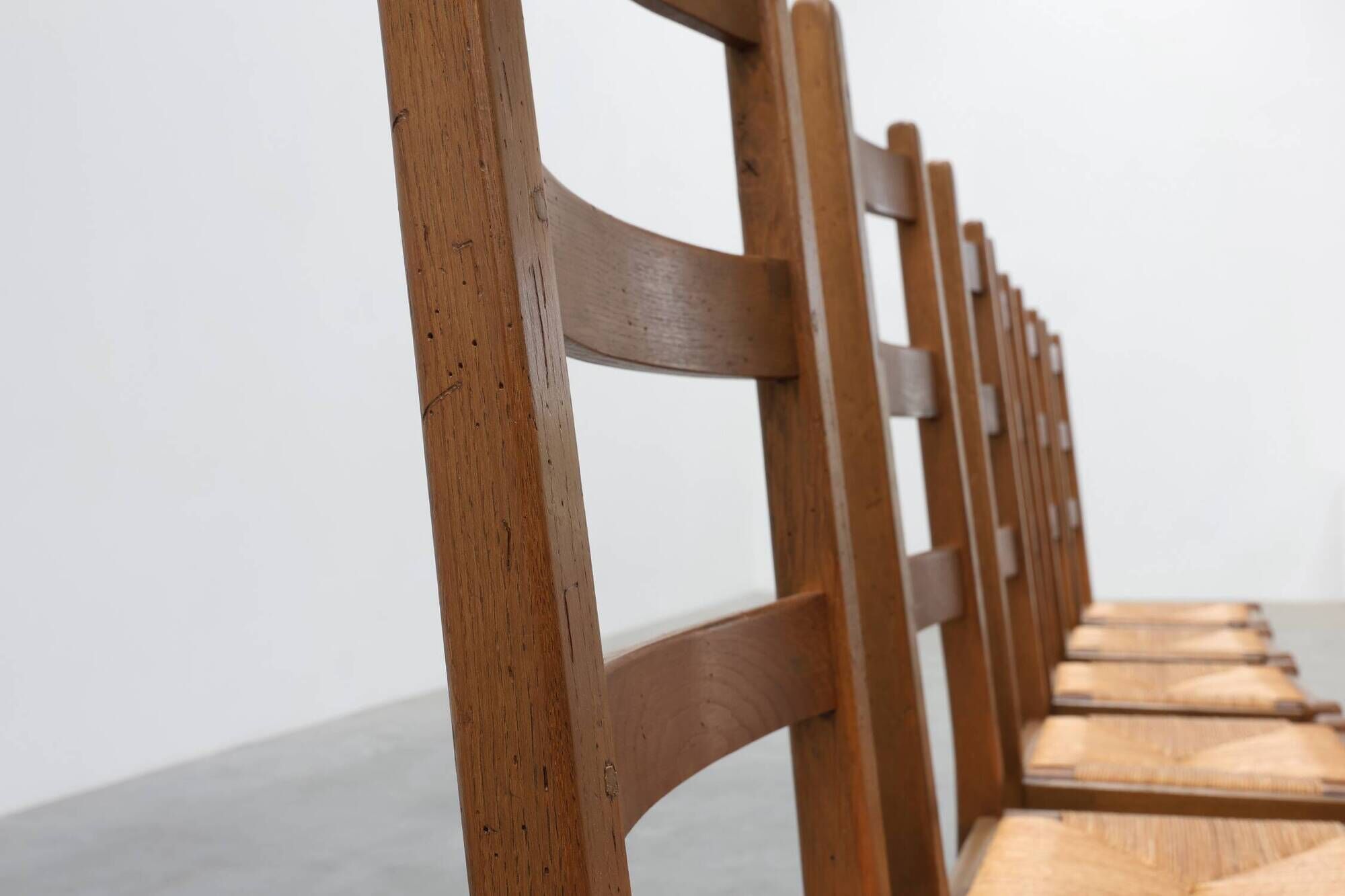 Set of 6 rustic oak ladder-back chairs with rush seats, France, 20th centur