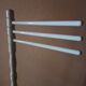 Bath towel rack in white wood, three bars.