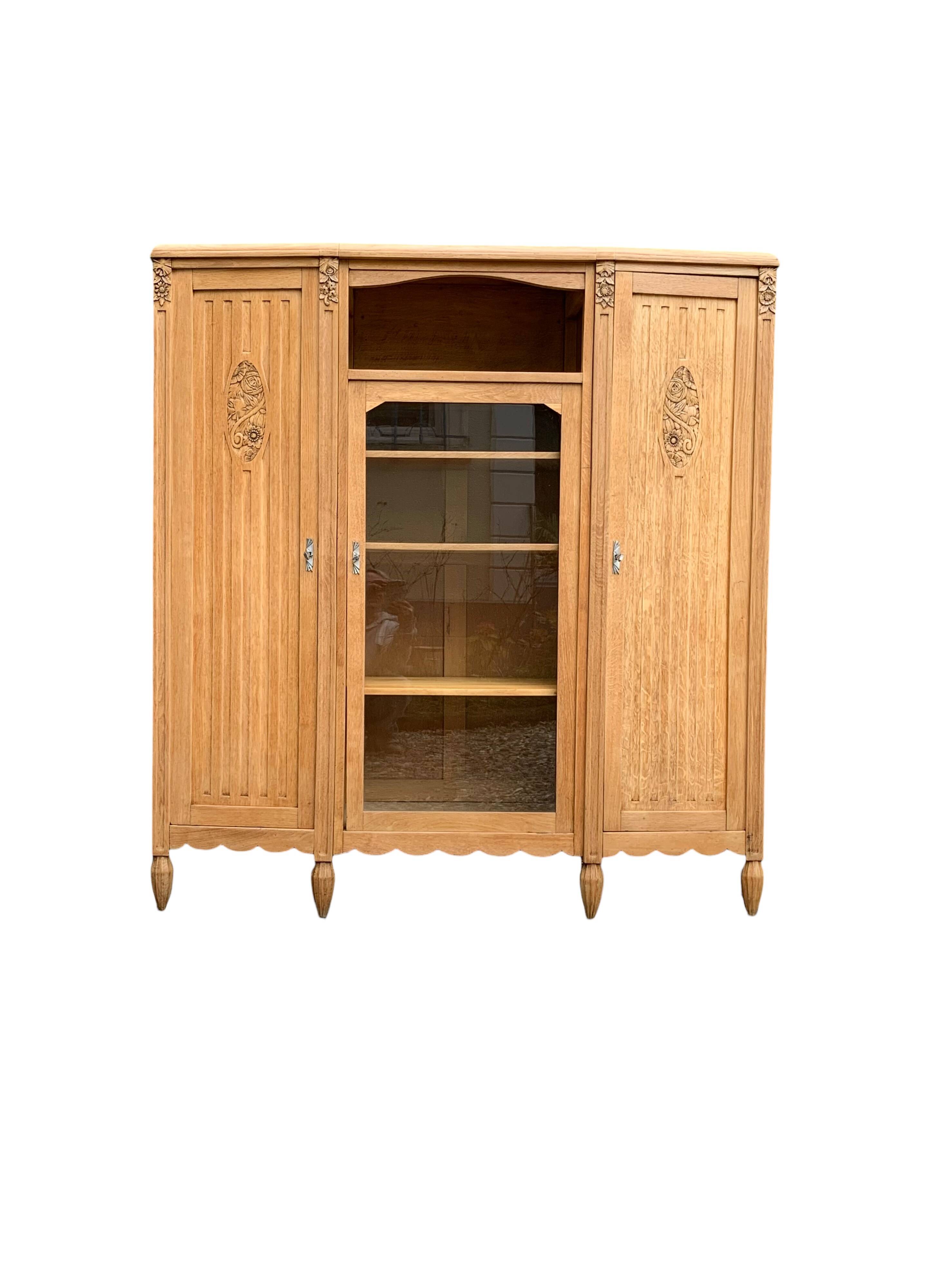 Parisian Art Deco asymmetrical glass cabinet in raw oak, 1930