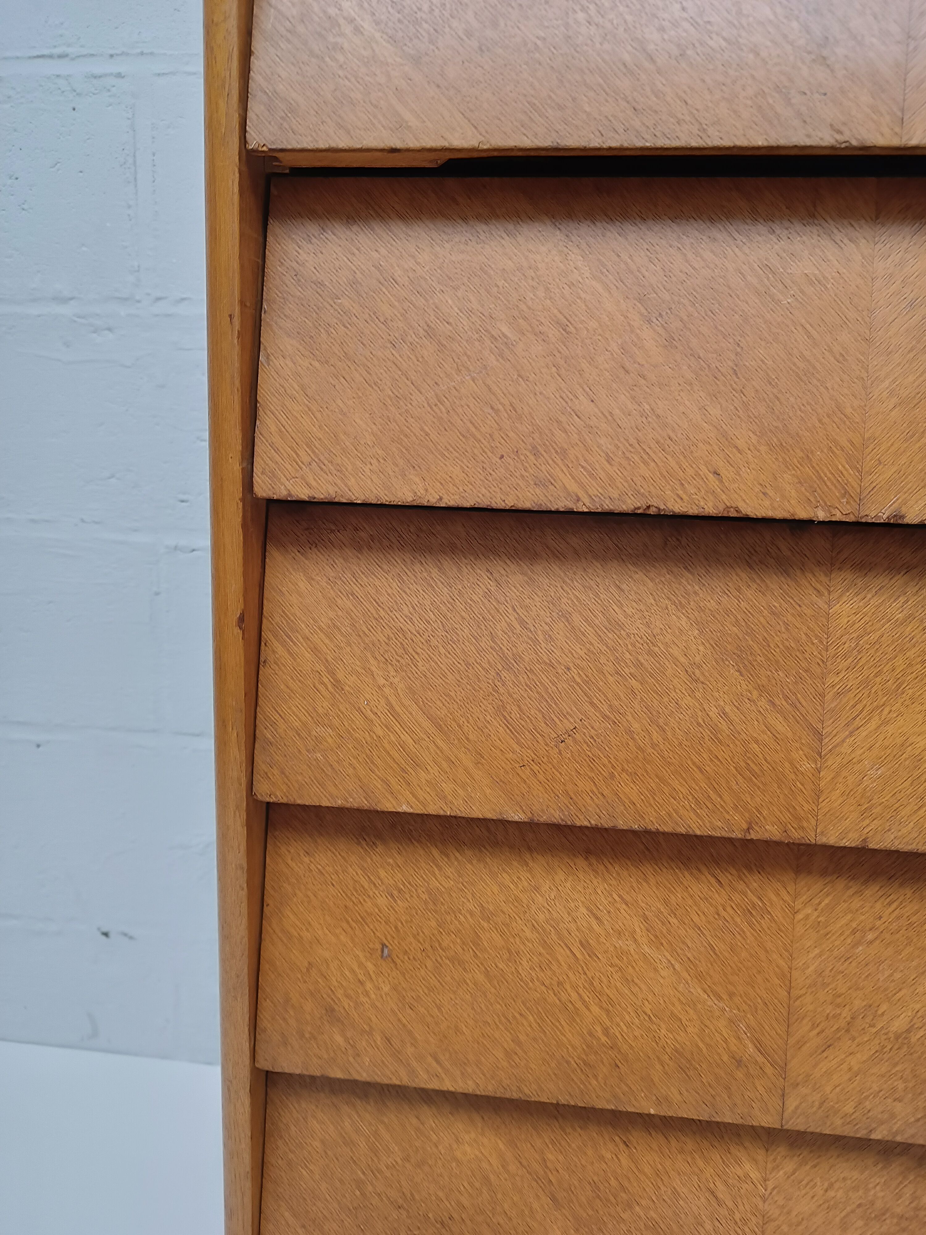 High wooden chest of drawers in the 50s