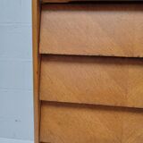 High wooden chest of drawers in the 50s