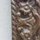 Bevelled mirror from the 1930s in repoussé brass.