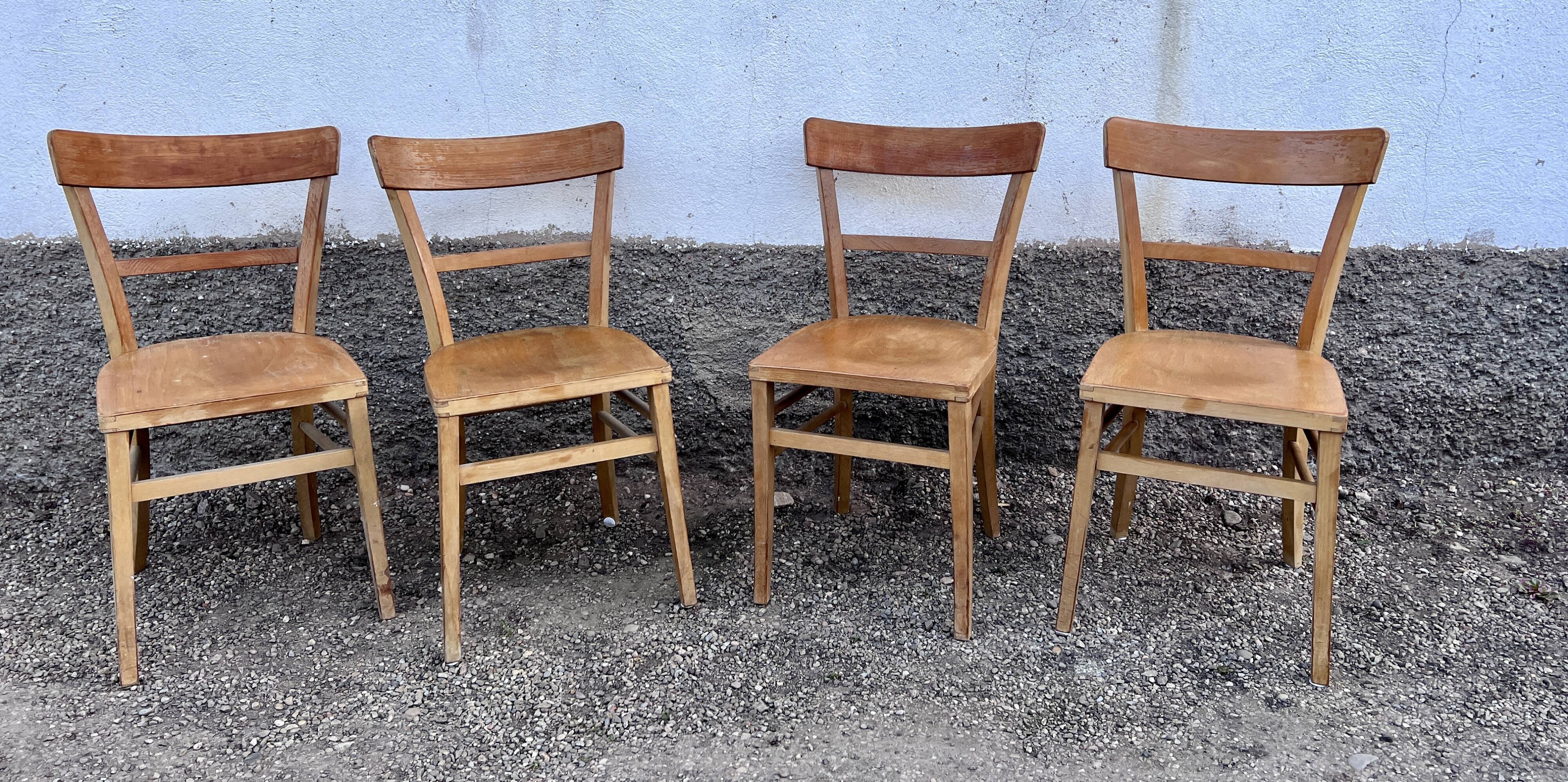 Series of 4 chairs in vintage light wood beech