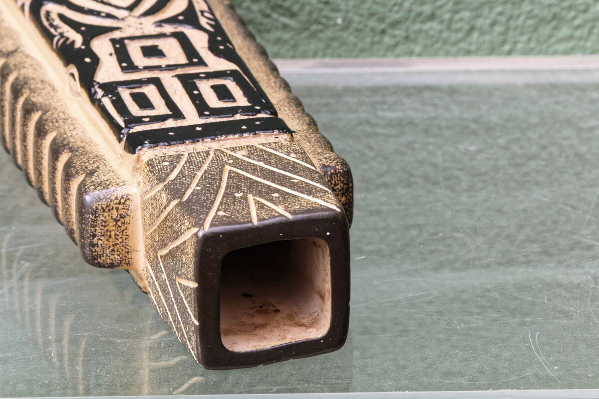 Modernist ceramic vase, signed, with incised geometric tribal decoration.