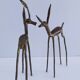 four vintage brass gazelle antelope sculptures