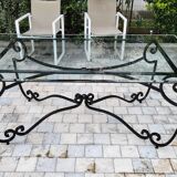 Large rectangular table in cast iron and glass top