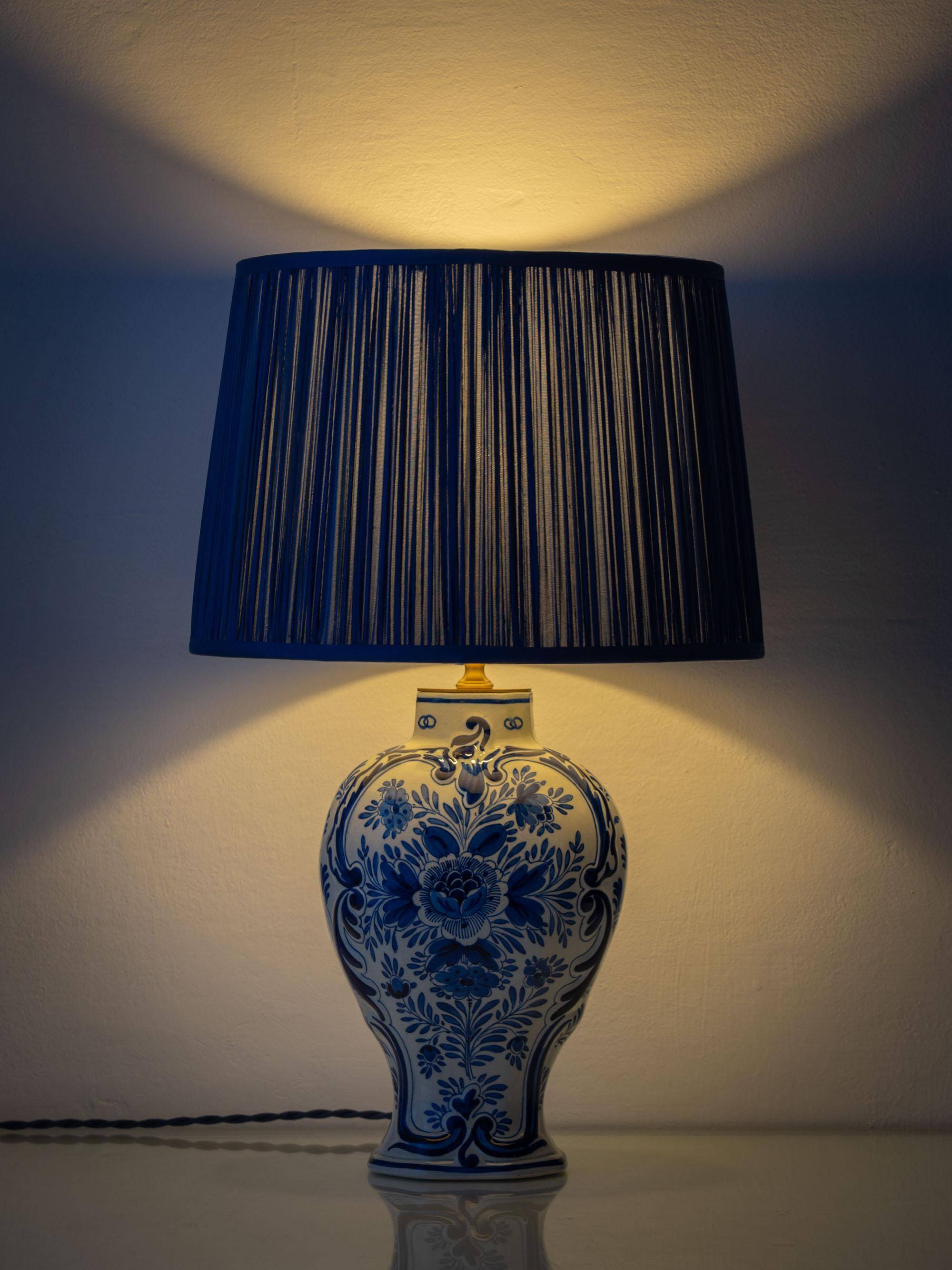 Pair of Royal Delft blue and white ceramic table lamps, 1905, with new pleated silk shades.