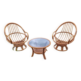 Set of 2 swivel armchairs and 1 wicker coffee table.