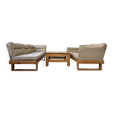 Two vintage Swedish sofas and a pine table