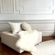 Square ottoman and its cushions in buckle fabric