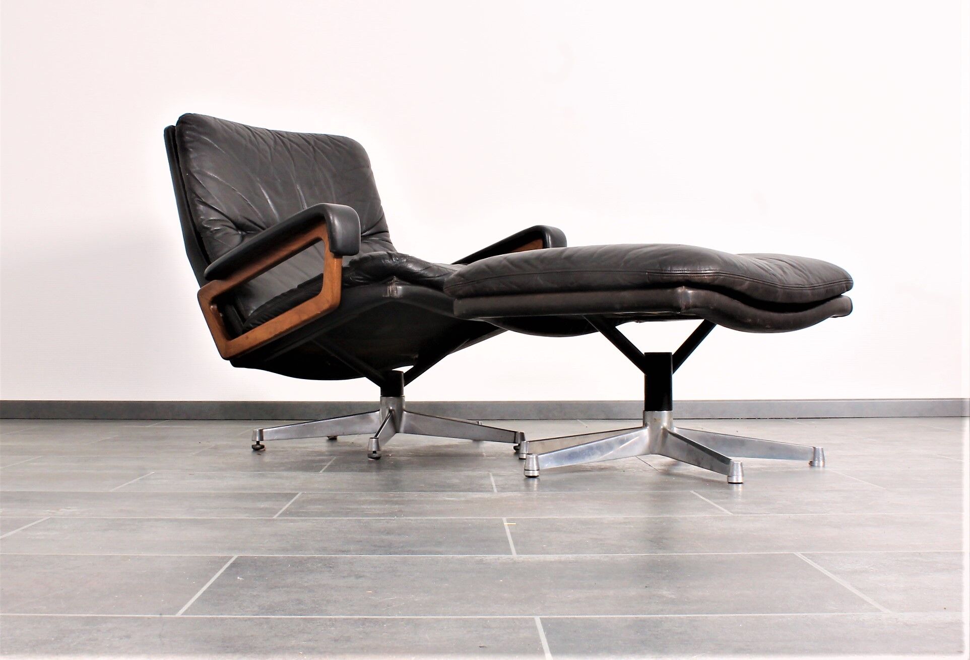 Armchair and footstool by André Vandenbeuck for Strässle in black leather