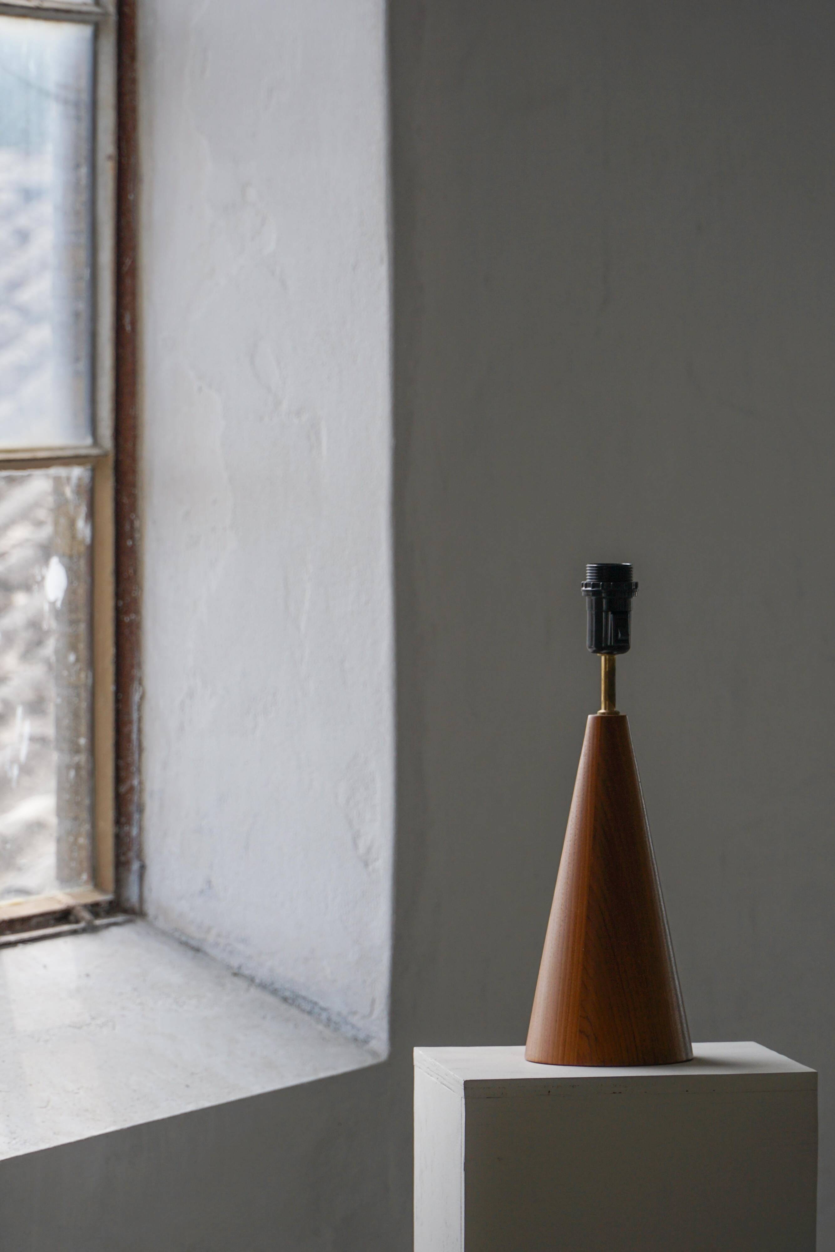 Modern Danish, a conical table lamp in teak, 1980s.