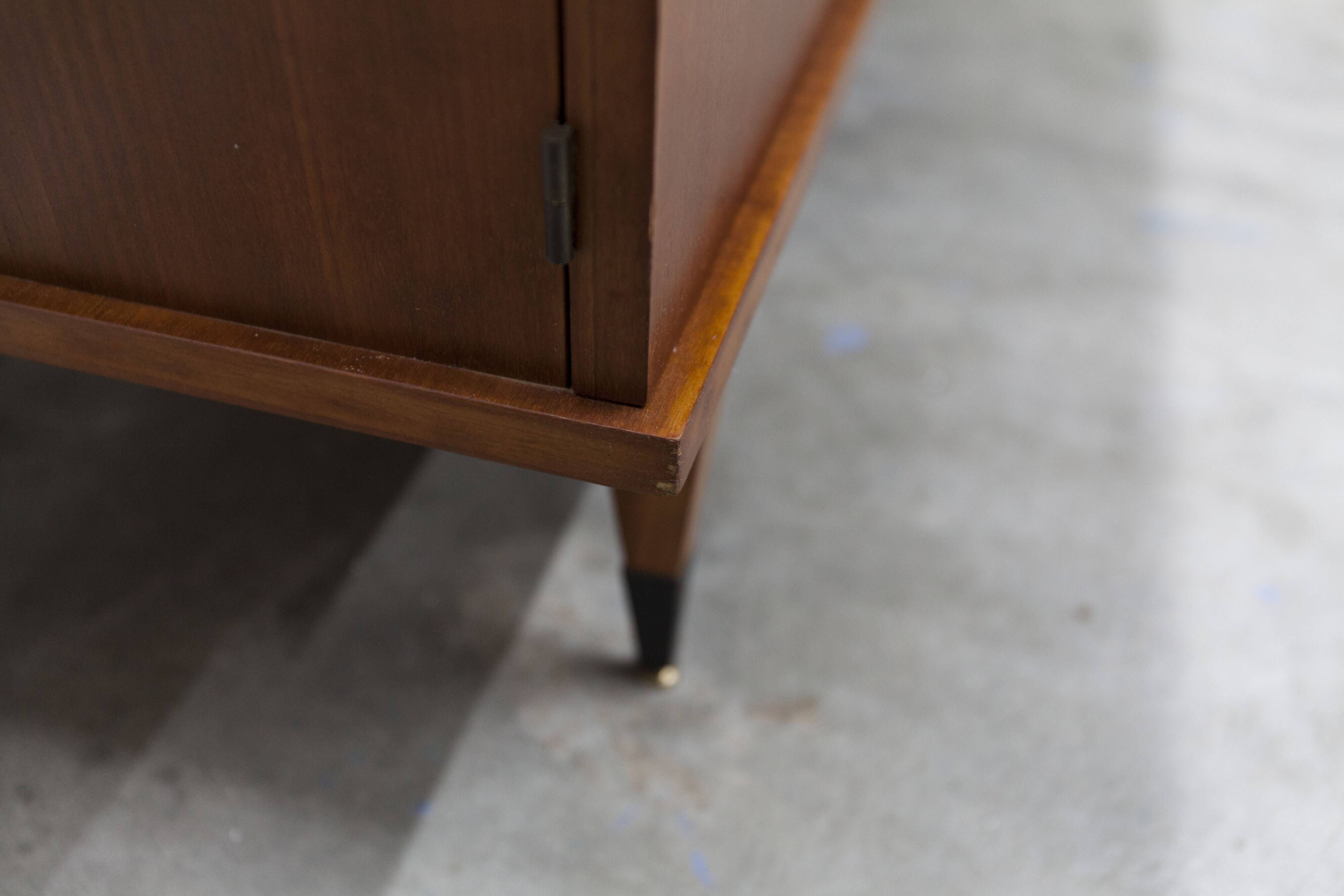 1960s teak sideboard with 4 drawers, 2 doors, and a mirror.