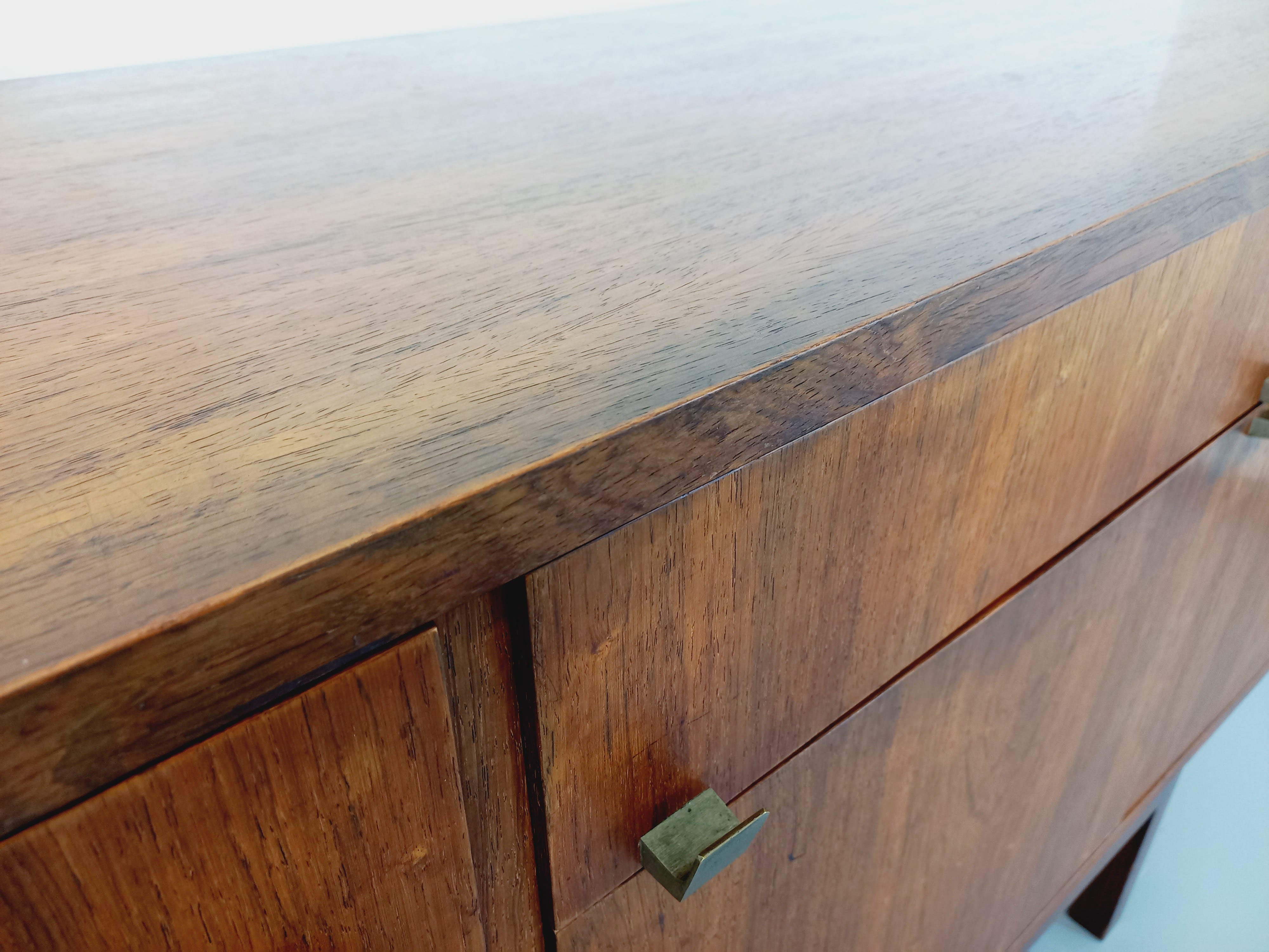 Vintage Scandinavian style row in rosewood and brass from the 60s