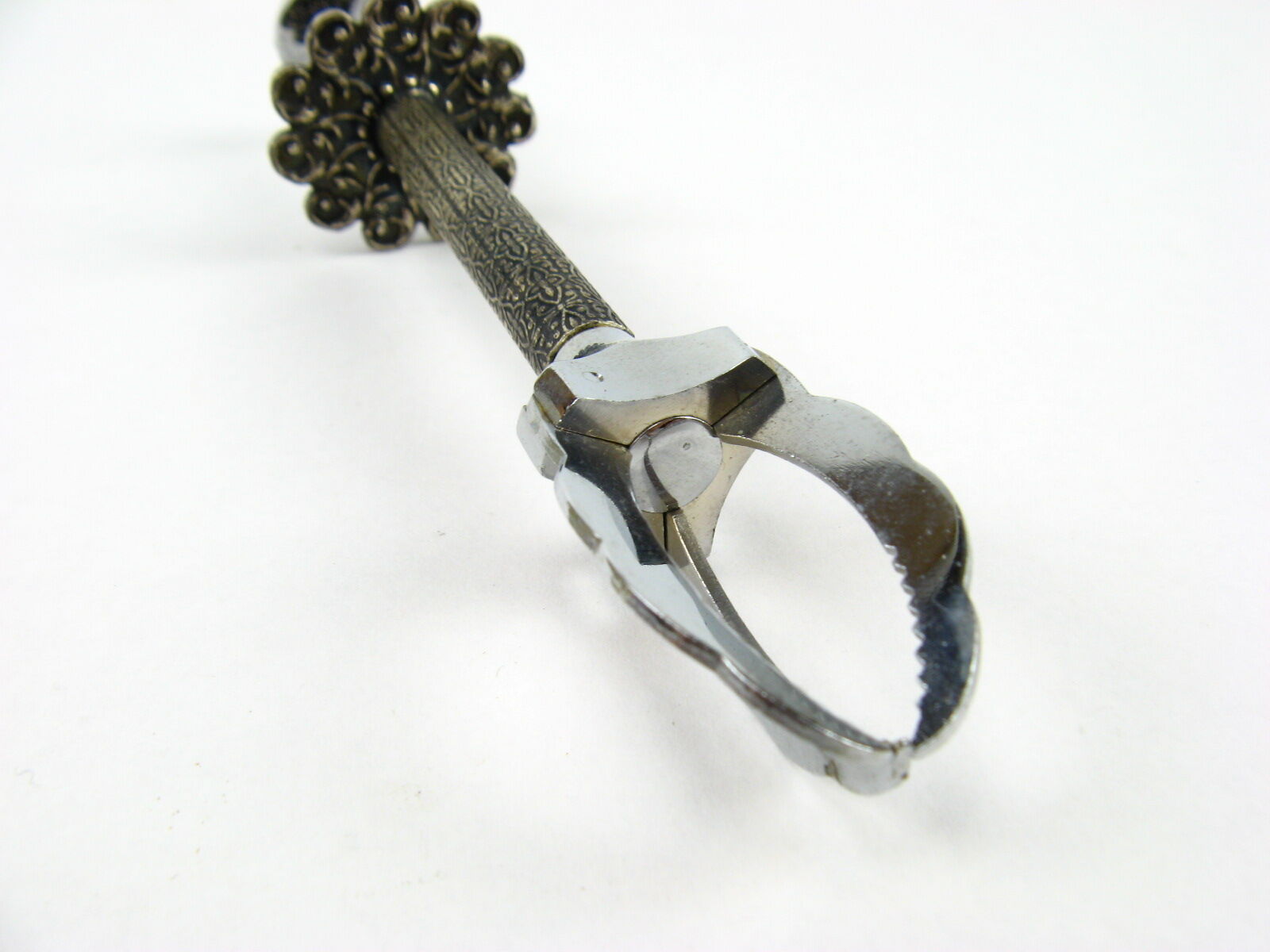 Sugar tongs in its case