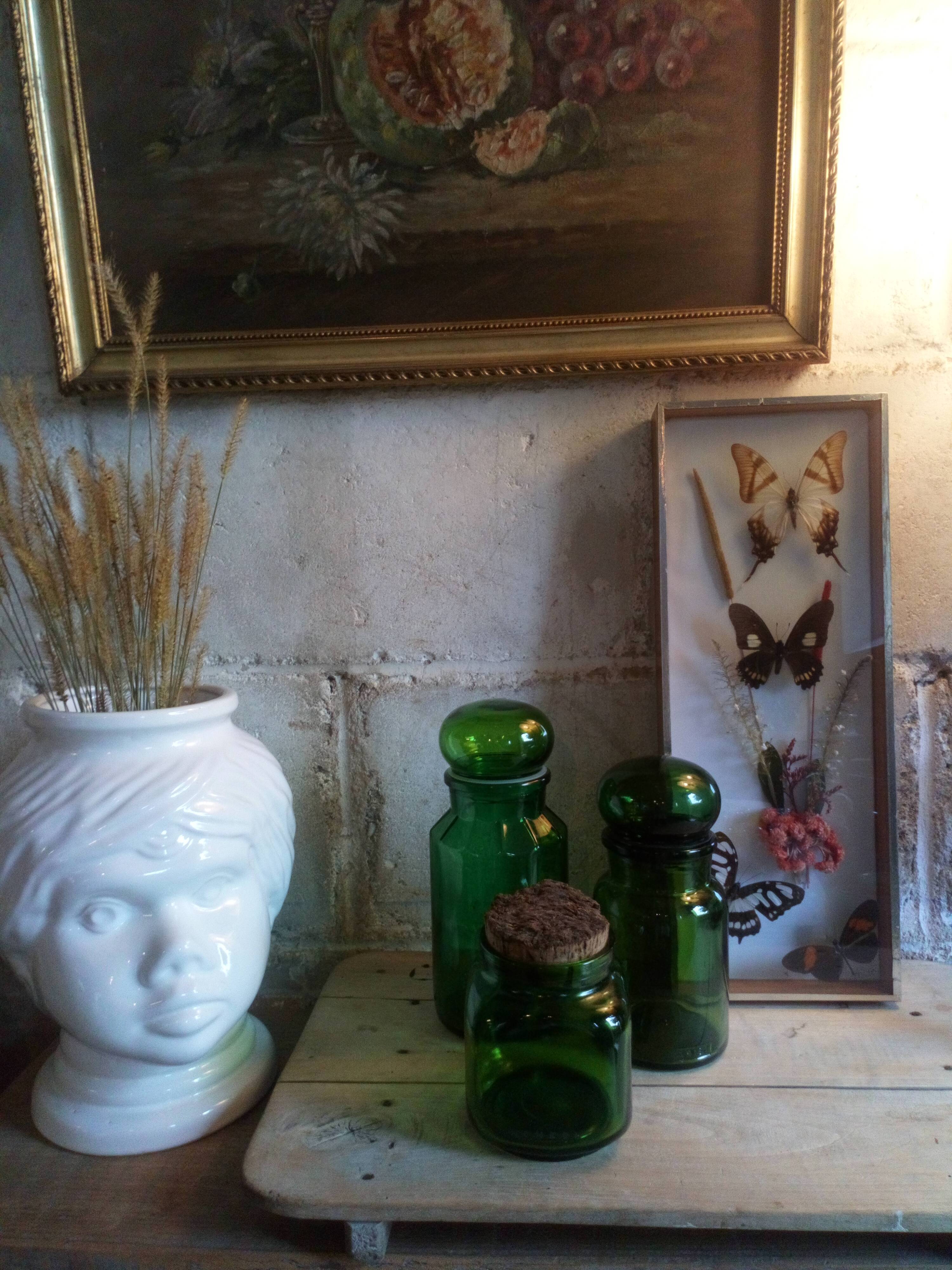 Trio of green glass apothecary bottles