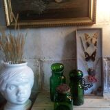 Trio of green glass apothecary bottles