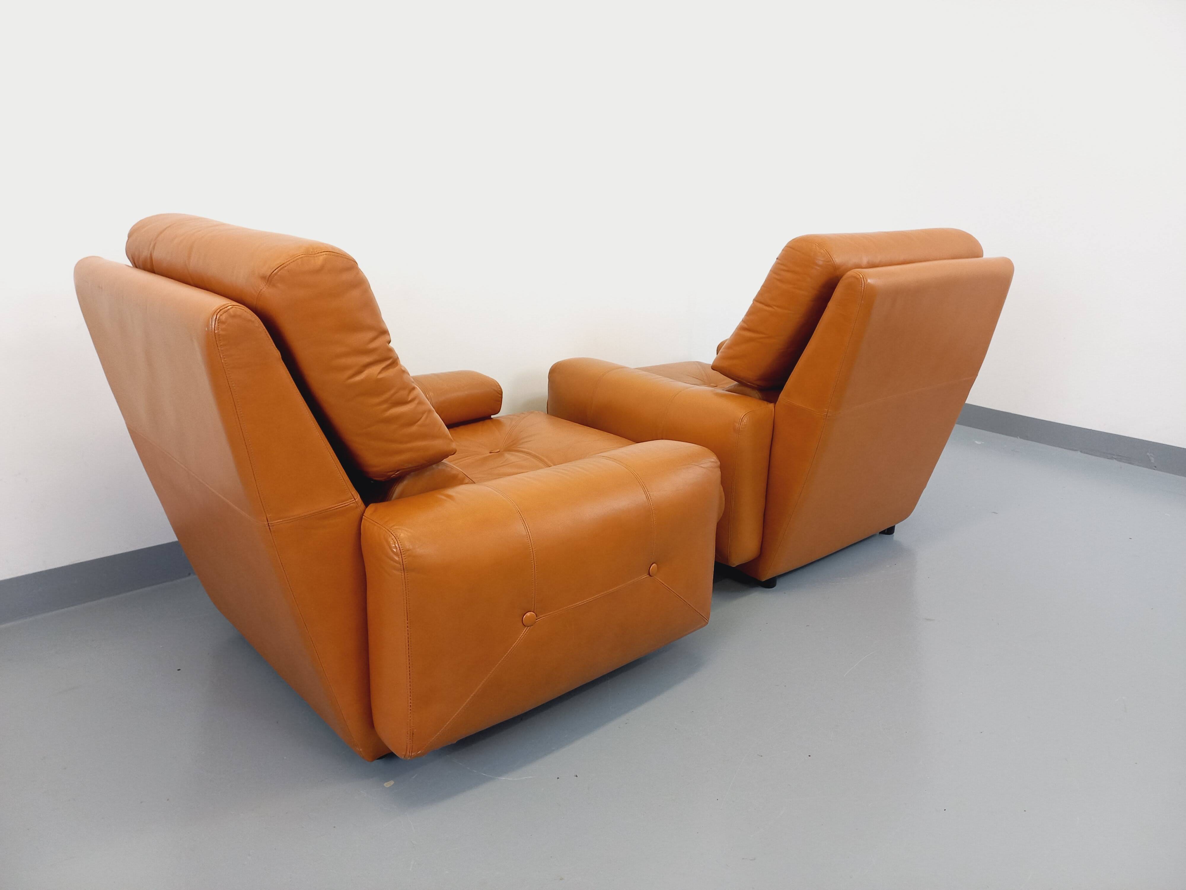 Pair of vintage leather lounge chairs from the 60s and 70s