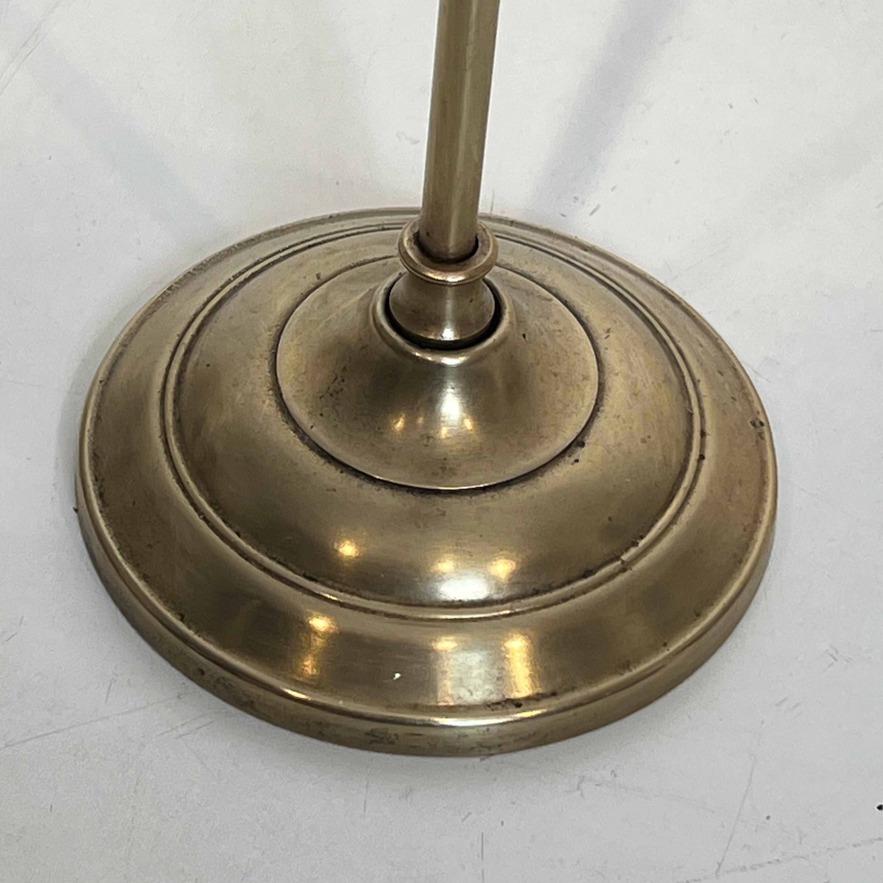Neoclassical brass fire accessory.
