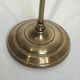 Neoclassical brass fire accessory.