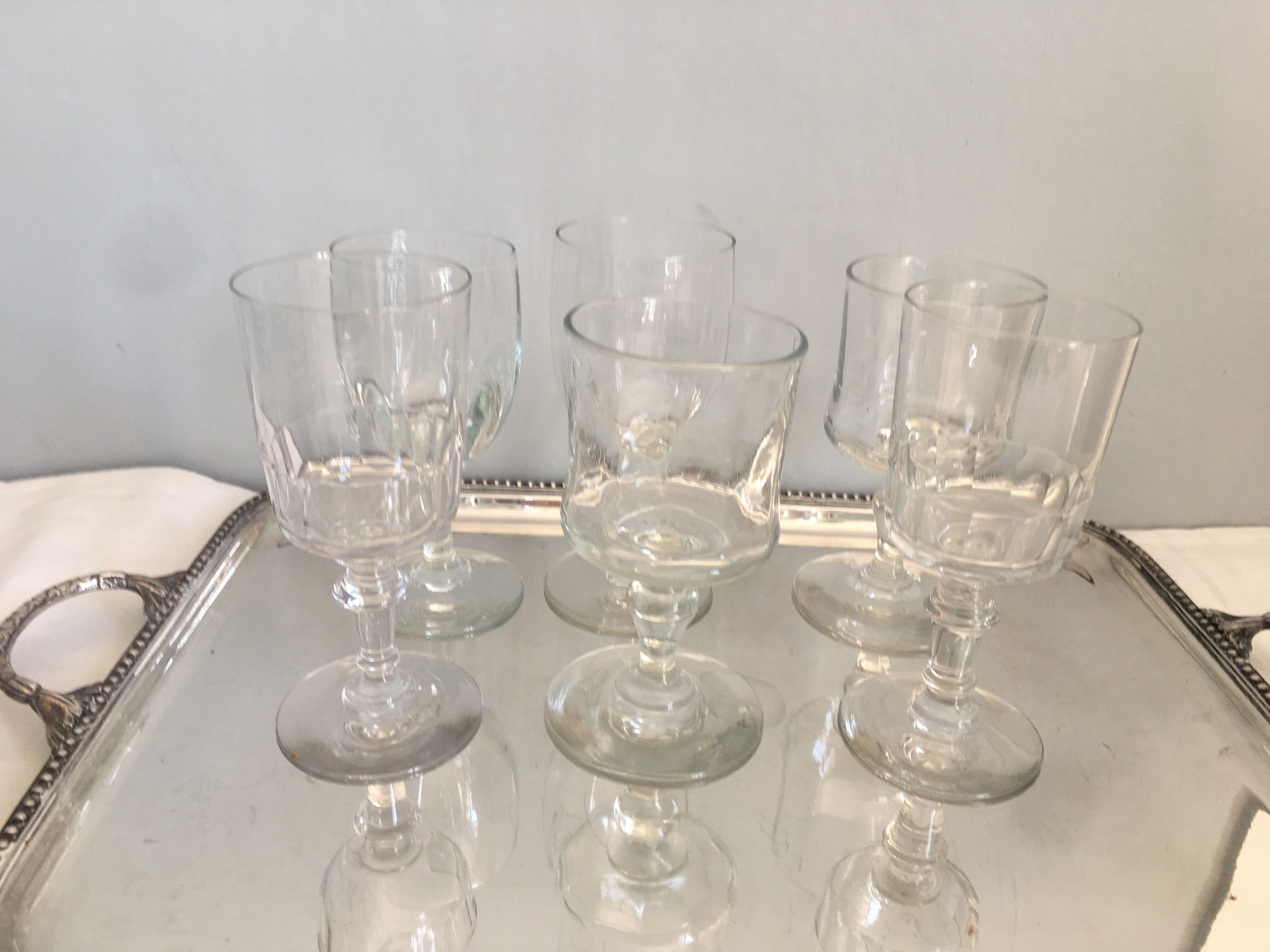 6 old mismatched water glasses
